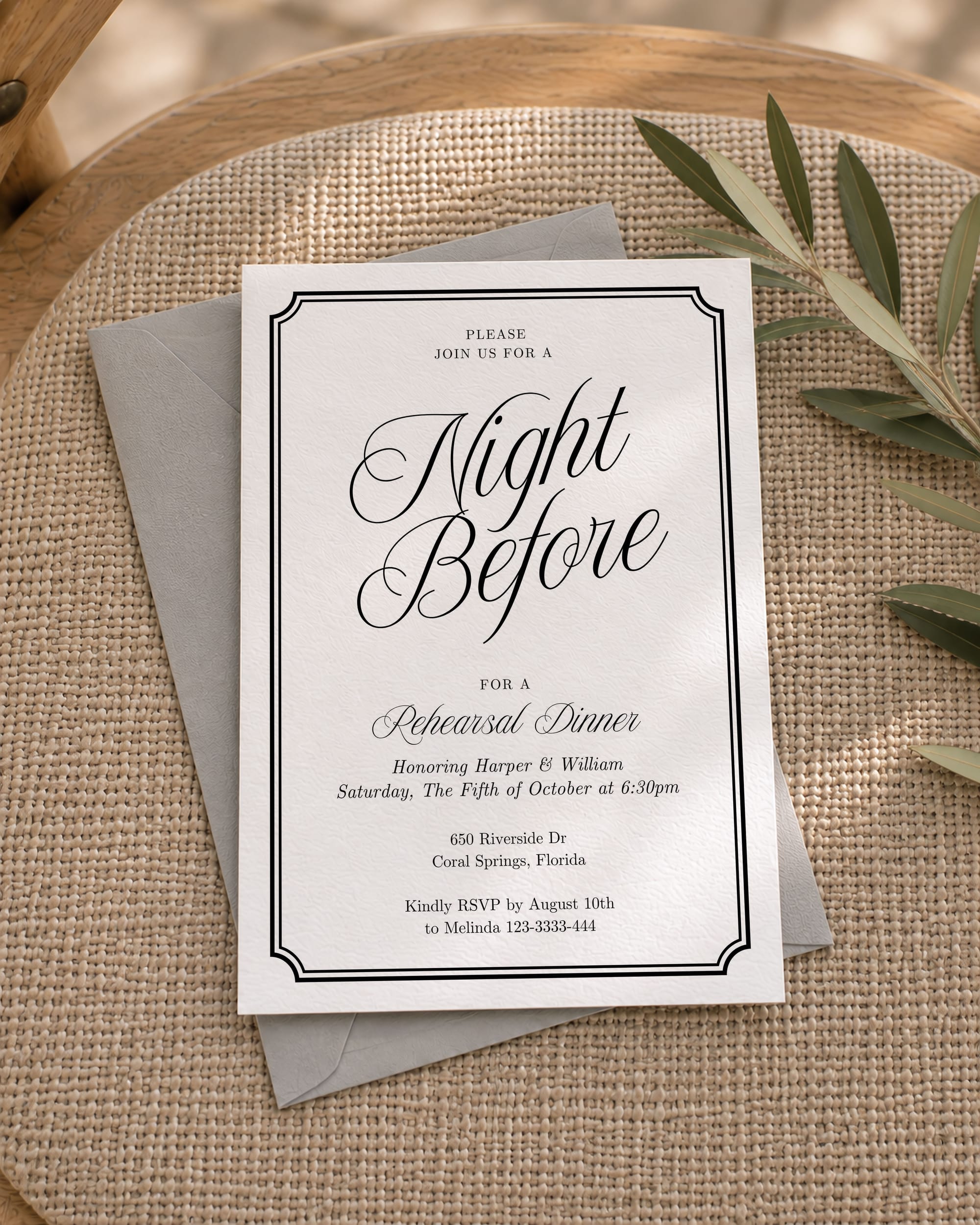 White invitation mockup with black text and an inset black border
